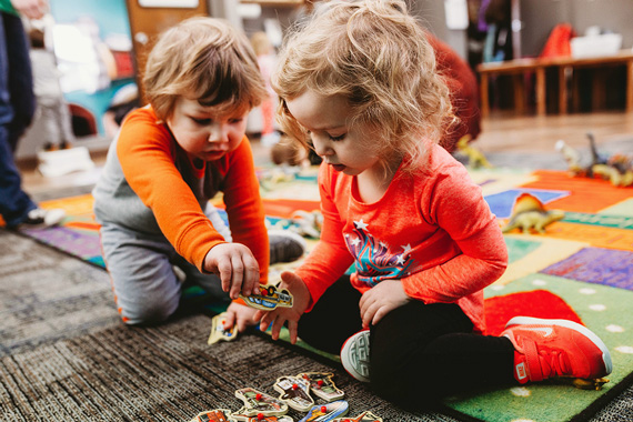 toddlers helping each other